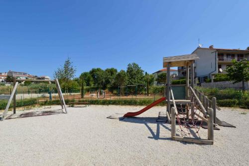 an empty playground with a slide and a swing at Apartment in Pula/Istrien 11082 in Veruda