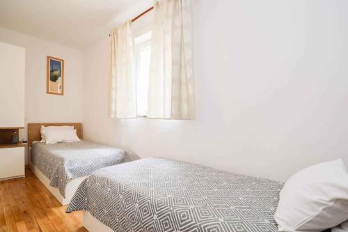 Postel nebo postele na pokoji v ubytování Apartment Pula, Istia 9