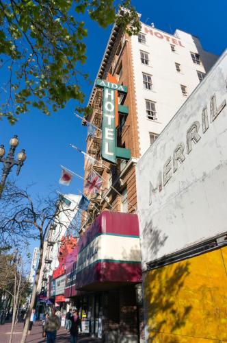 a building with a sign on the side of it at Aida Plaza Hotel in San Francisco