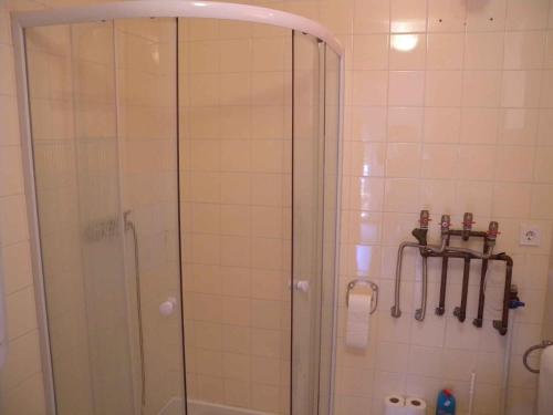 a shower with a glass door in a bathroom at Holiday home in Siofok - Balaton 20063 in Siófok