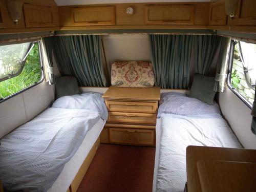 two beds in the back of a camper van at Holiday home Balatonkenese - Balaton 18975 in Balatonkenese