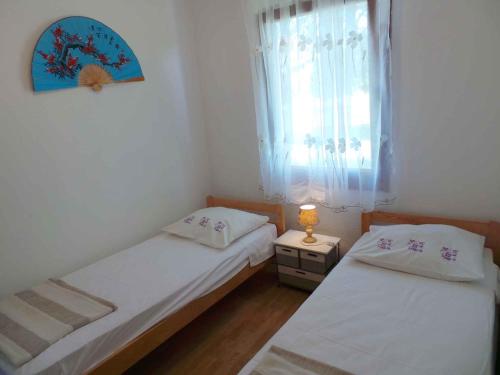 מיטה או מיטות בחדר ב-Holiday home in Medulin/Istrien 8949