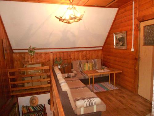 a room with a couch and a table in a house at Holiday home in Dolni Dvur 2374 in Dolni Dvur