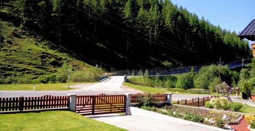 a road with a fence on the side of a mountain at Apartment in Schmirn - Tirol 717 in Schmirn