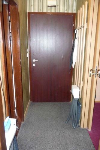a bathroom with a toilet in front of a door at Studio in Bad Aussee - Steiermark 428 in Bad Aussee