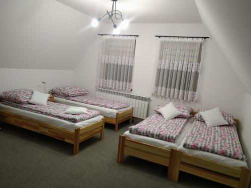 Postel nebo postele na pokoji v ubytování Domek u Mrugały