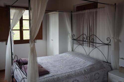 Voodi või voodid majutusasutuse Borgo di Gaiole - Casa BD - apartment with a view & travel guide toas