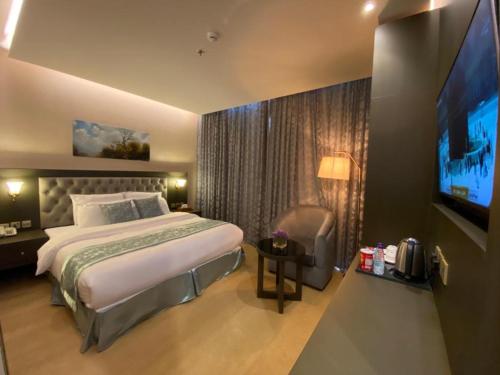 מיטה או מיטות בחדר ב-Sama Inn Hotel