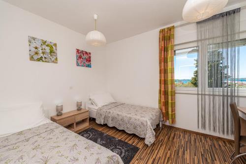Posteľ alebo postele v izbe v ubytovaní Antonio Apartments
