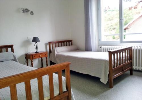 Ένα ή περισσότερα κρεβάτια σε δωμάτιο στο GÎTE GUERY