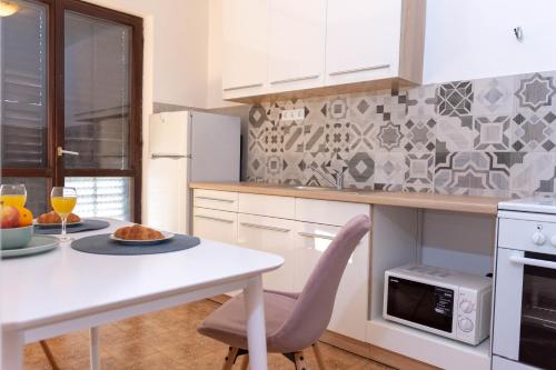 Η κουζίνα ή μικρή κουζίνα στο Apartman Duce Milka