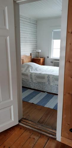Een bed of bedden in een kamer bij Sweden B&B "Lundbergs"