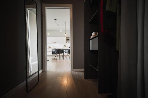 a hallway with a mirror and a dining room at Dreams Hotel Città Studi in Milan