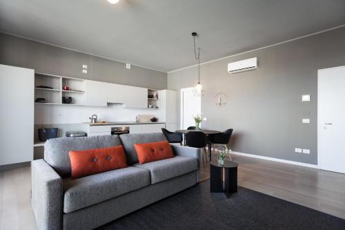 a living room with a couch and a table at Dreams Hotel Città Studi in Milan