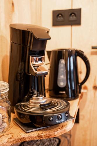 a coffee maker sitting on top of a counter at La Cabane Ofuro in Celles