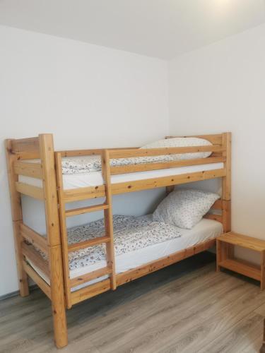 a bunk bedded room with a bunk bed frame and shelves at Schwarzwaldmarie Ferienwohnung in Löffingen