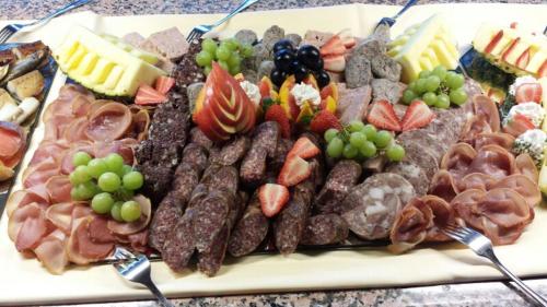 a tray of different types of food on a table at Pension Harzbaude Susanne - Garni in Rübeland