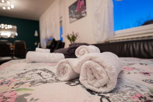 a towel animal sitting on top of a bed at Apartman Vesna in Bjelovar