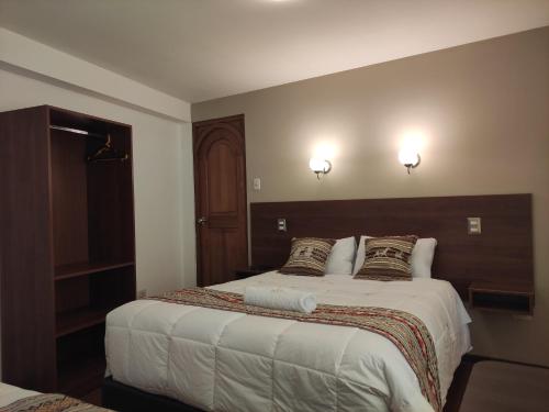 Una cama o camas en una habitación de Casa del Escultor