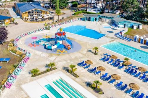 an aerial view of a pool at a resort at Mobil home 6/8 pers Les Dunes de Contis in Saint-Julien-en-Born