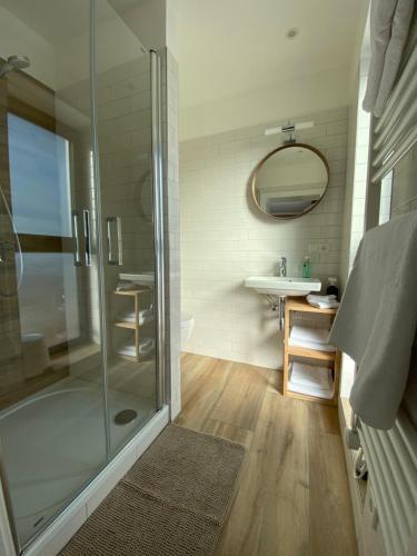a bathroom with a shower and a sink at Haus Stadler - Self Check-in in Tauplitz
