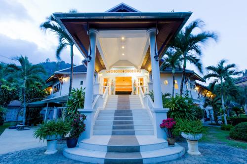 a house with a staircase leading to the front door at Serenity Lakeside Resort in Kathu