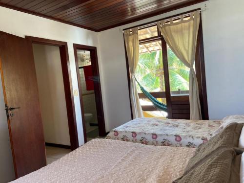 Postel nebo postele na pokoji v ubytování Casa de praia em condomínio à beira mar