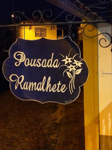 a sign that says pucadia ramadanitute on a building at Tiradentes Pousada Ramalhete in Tiradentes