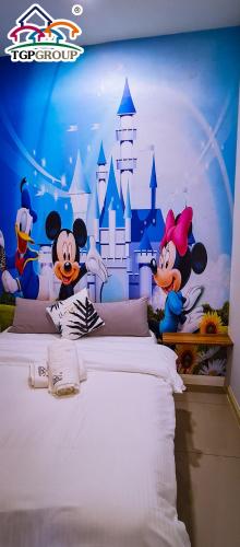 a bedroom with mickey mouse and a disney castle mural at Legoland D'PRISTINE Apartment By TGP in Nusajaya