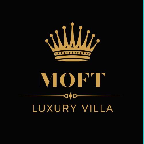 a gold crown logo on a black background at MOFT Villa in Predeal