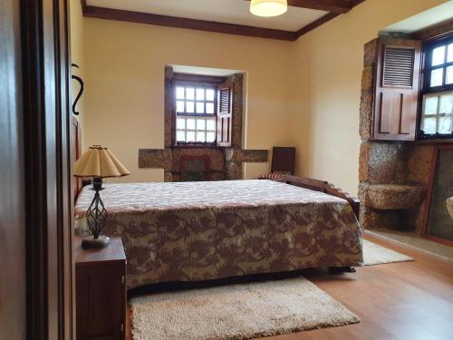 Ліжко або ліжка в номері Casa dos Chãos