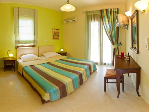 מיטה או מיטות בחדר ב-Eligia Villas