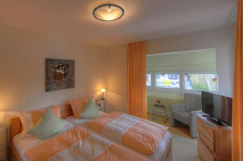 Un pat sau paturi într-o cameră la Aparthotel Klara