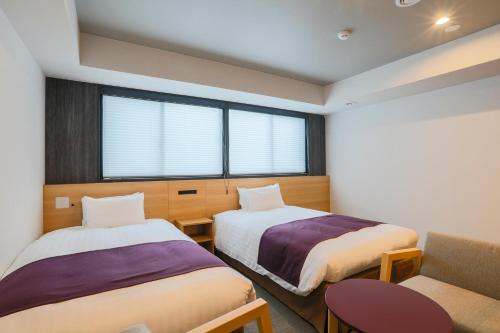 Katil atau katil-katil dalam bilik di KOKO HOTEL Kyoto Sanjo - formerly Hotel Wing International Premium Kyoto Sanjo