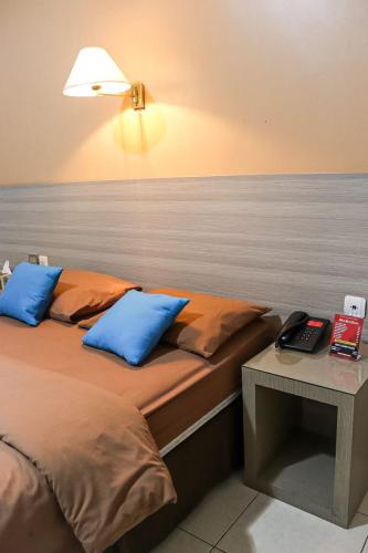 Hotel Pesona Merakにあるベッド