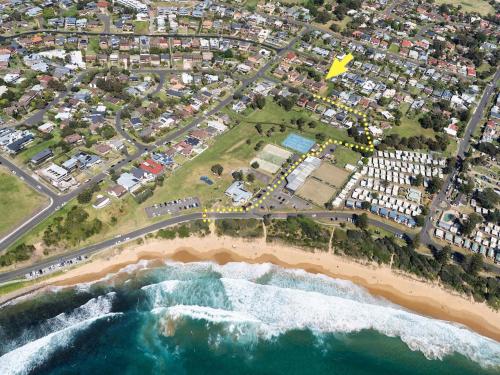 an aerial view of a beach and the ocean at Cloud Nine Gerringong in Gerringong