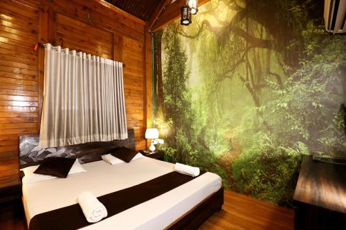 Katil atau katil-katil dalam bilik di Pali Village Resort