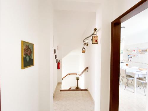 a hallway with a dining room and a table at Retreat with Terrace and View in Espiche #1887 in Espiche