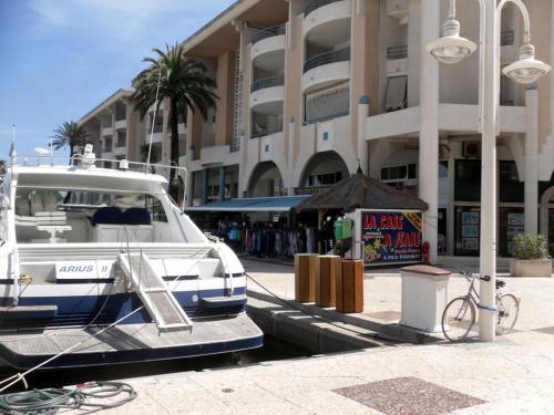 a police car parked in front of a building at Résidence du Port - Borghese in Fréjus