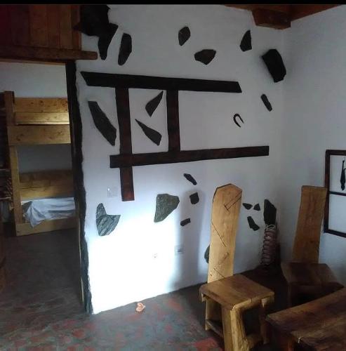 a room with a wall with a painting on the wall at Apartmani Pinkum in Veliko Gradište