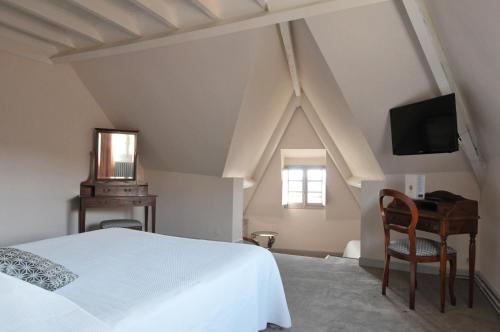 Кровать или кровати в номере Le Relais St jacques