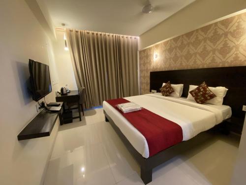 Gulta vai gultas numurā naktsmītnē Hotel Singh`s By WB Inn, Vashi, Navi Mumbai