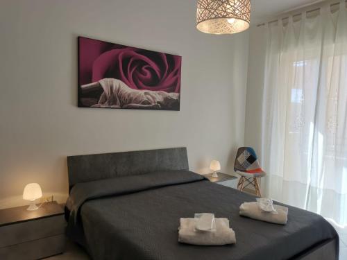 A bed or beds in a room at Casa Lido Piccolo