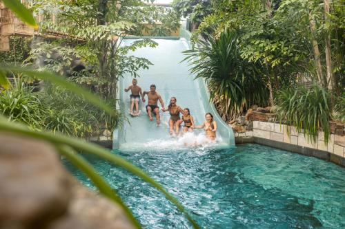 a group of people on a water slide at Hotel Eemhof by Center Parcs in Zeewolde
