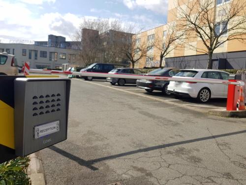 a parking lot with cars parked in a parking lot at Euro Hôtel Paris Créteil in Créteil