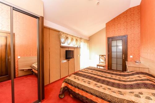 Ένα ή περισσότερα κρεβάτια σε δωμάτιο στο Villa Regina - Apartment Complex Resort in Šventoji