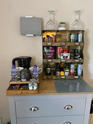 a kitchen counter with a spice rack on the wall at The Old Brasserie & Rooms @ no.8 in Dartmouth