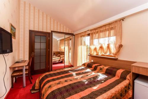 Ένα ή περισσότερα κρεβάτια σε δωμάτιο στο Villa Regina - Apartment Complex Resort in Šventoji