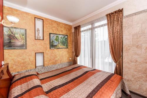 Ένα ή περισσότερα κρεβάτια σε δωμάτιο στο Villa Regina - Apartment Complex Resort in Šventoji
