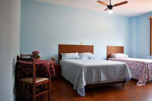 Säng eller sängar i ett rum på Palace Hotel Itapira